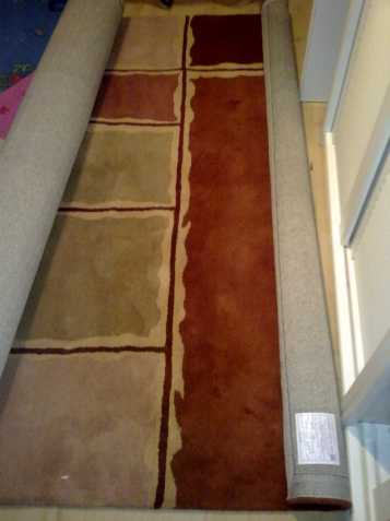 Ručně tkaný vlněný koberec